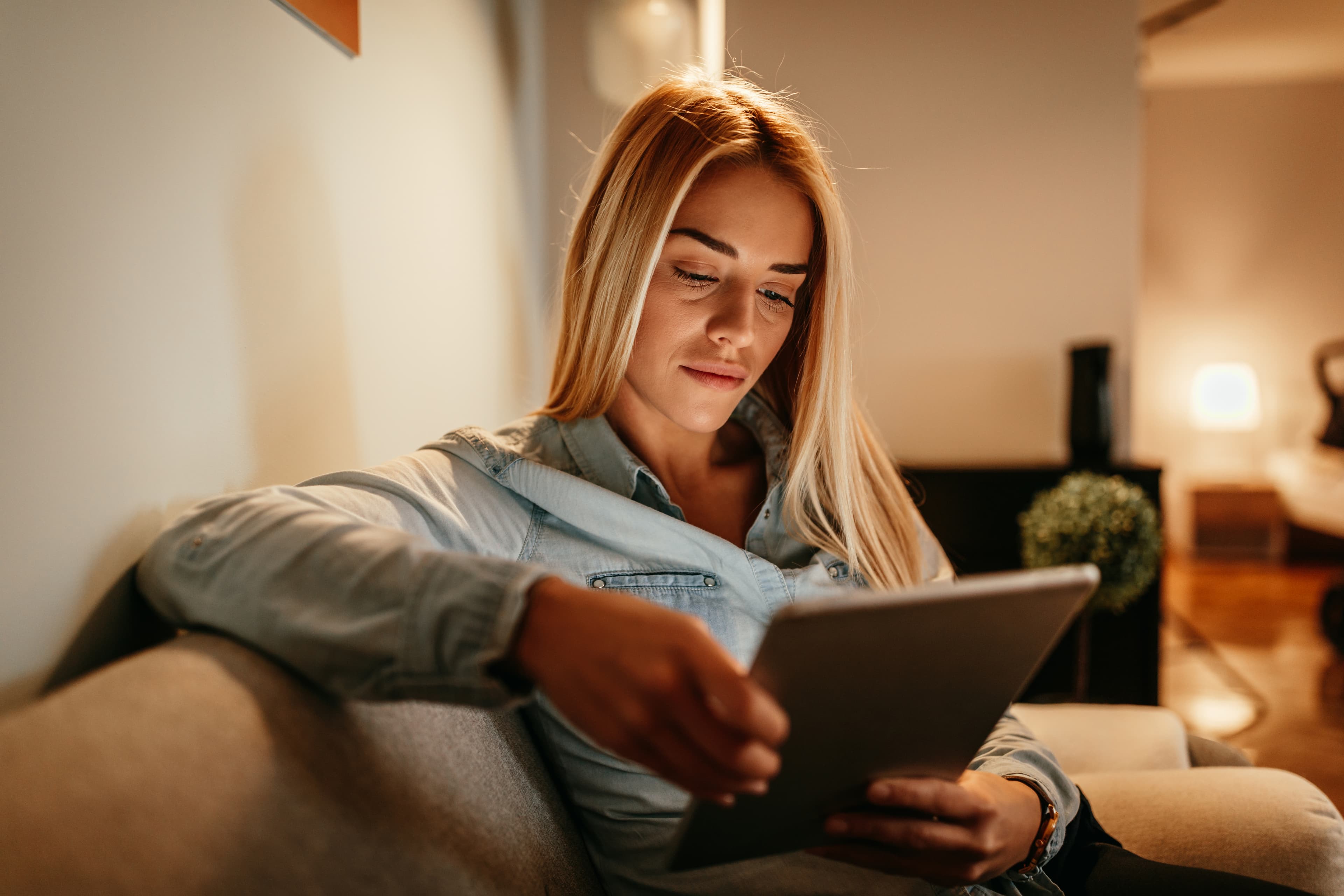 A customer browsing on a tablet at home
